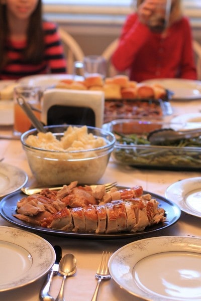 A Thanksgiving table spread with food.